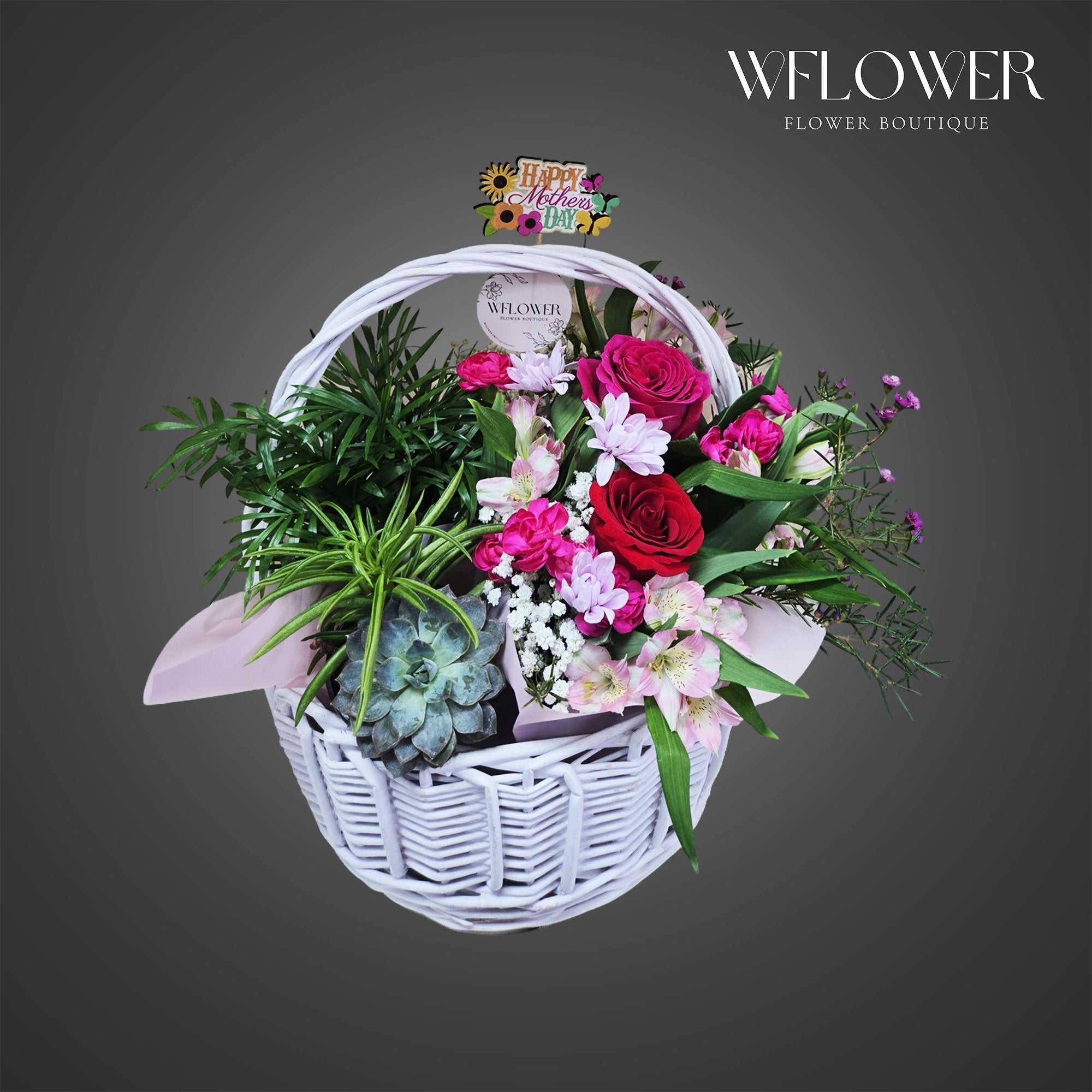 Mother’s Day floral basket with roses, mixed blooms and succulent