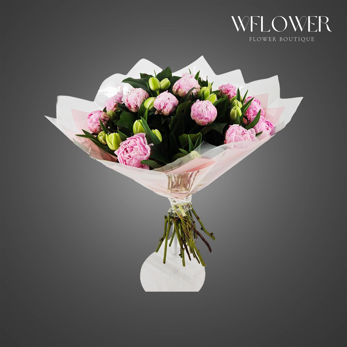 Blush pink peony and lily bouquet wrapped in luxury floral paper