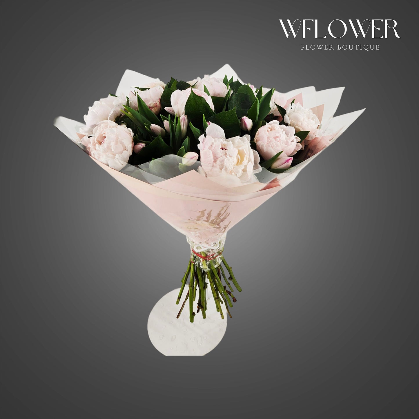 Soft blush peony bouquet wrapped in pastel floral paper