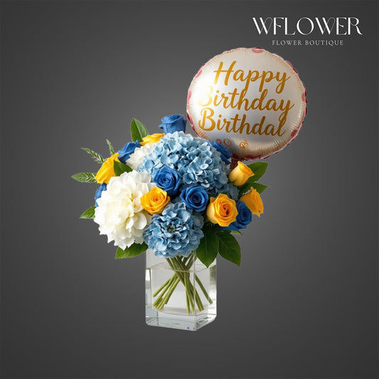Birthday Wishes Bouquet with white blue hydrangeas dark blue and yellow roses and birthday balloon.